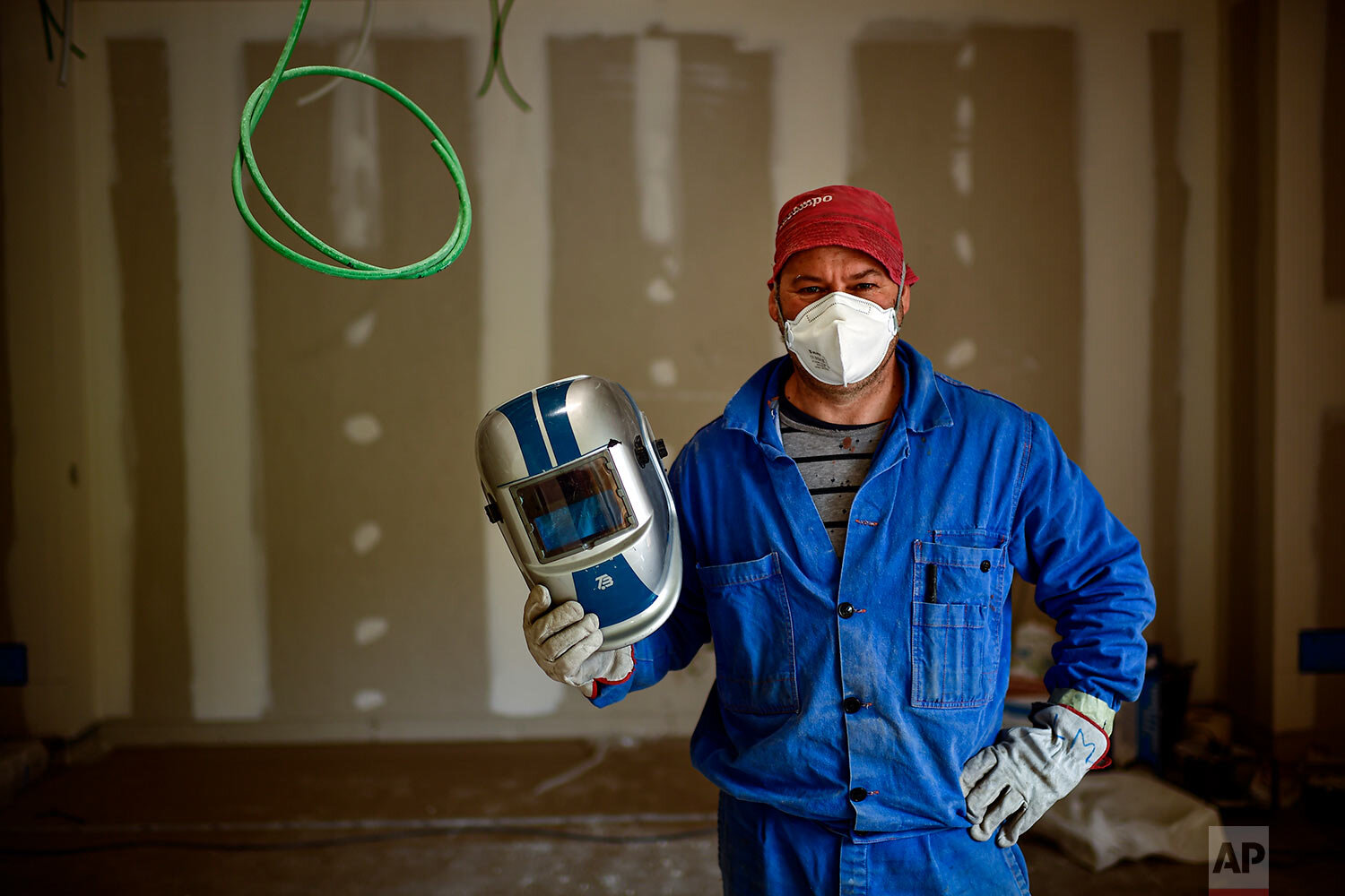  Marcelo Lopez, a construction worker poses for a photograph in Pamplona, northern Spain. (AP Photo/Alvaro Barrientos) 