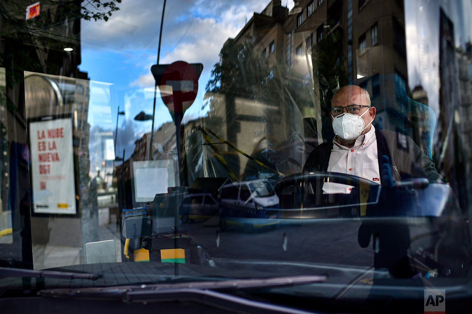  Driver Manuel Perez Munoz poses for a photograph inside his bus in Pamplona, northern Spain. (AP Photo/Alvaro Barrientos) 