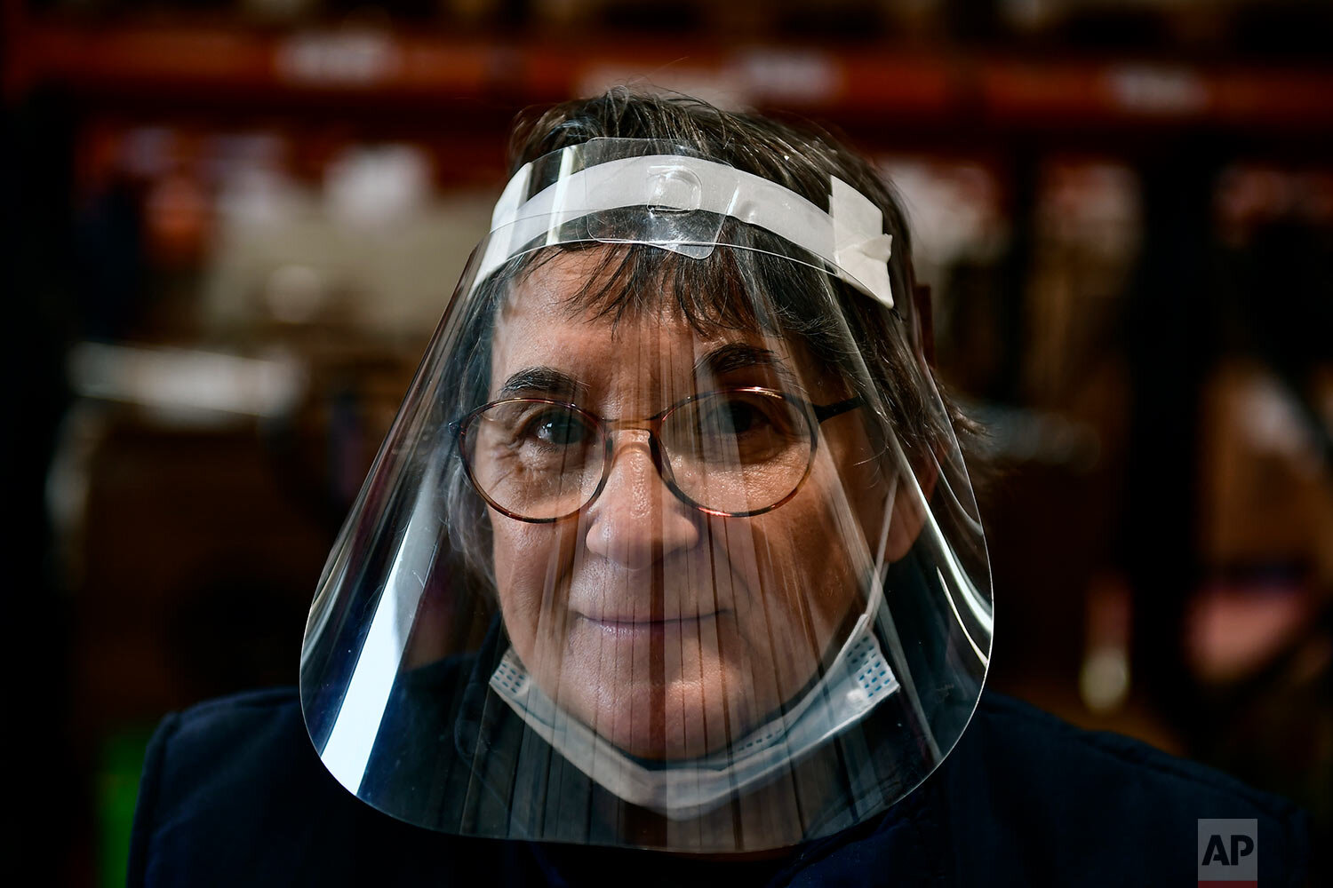  Marisol Villar, a pensioner working as volunteer for a charity foundation, poses for a photograph in Pamplona, northern Spain. (AP Photo/Alvaro Barrientos) 