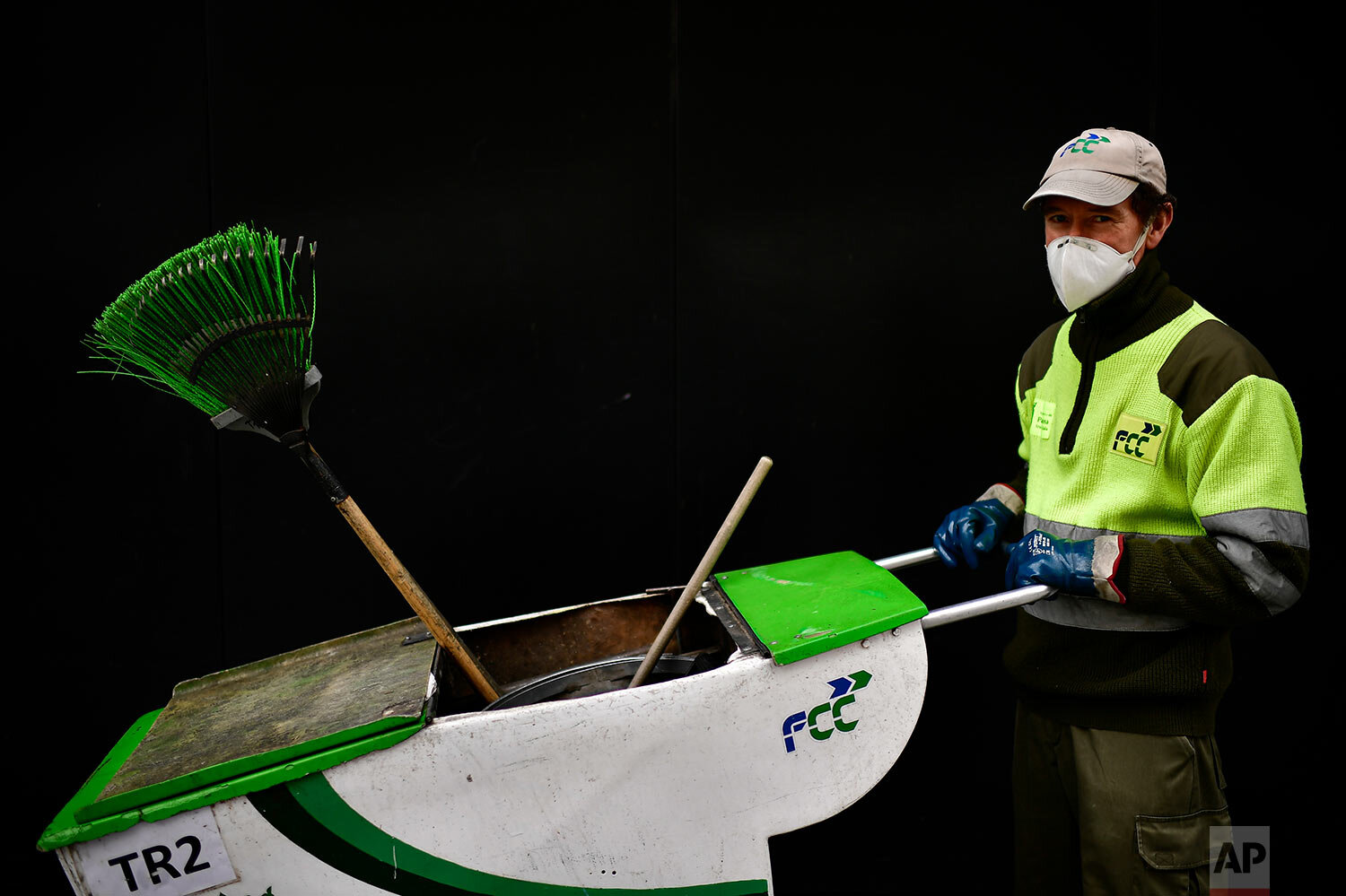  Public sweeper Jose Bataller poses for a photograph in Pamplona, northern Spain. (AP Photo/Alvaro Barrientos) 