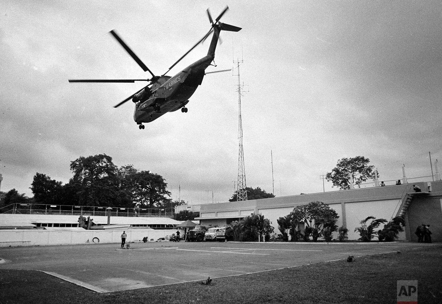  A helicopter lifts off from the U.S. embassy in Saigon, Vietnam during last minute evacuation of authorized personnel and civilians, April 29, 1975. (AP Photo) 