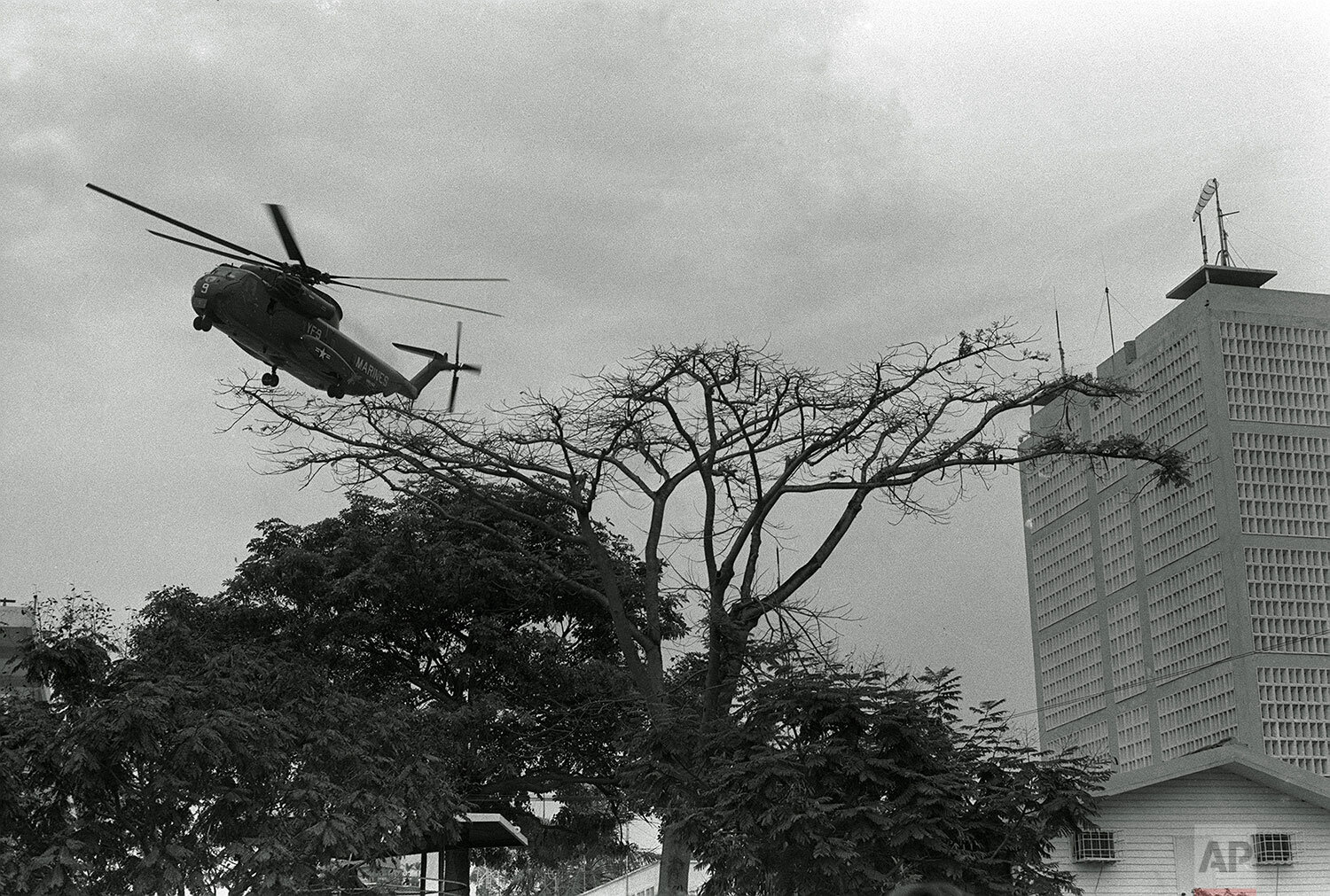  A U.S. Marine helicopter lifts off from the landing pad atop the U.S. Embassy during the evacuation of Saigon Wednesday, April 30, 1975. (AP Photo/phu) 