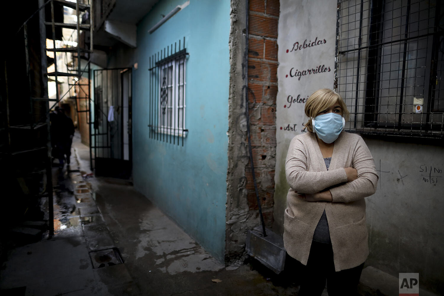 Cristina Rodriguez stands outside her home in “Villa 31” in Buenos Aires, Argentina, Tuesday, May 5, 2020. (AP Photo/Natacha Pisarenko) 