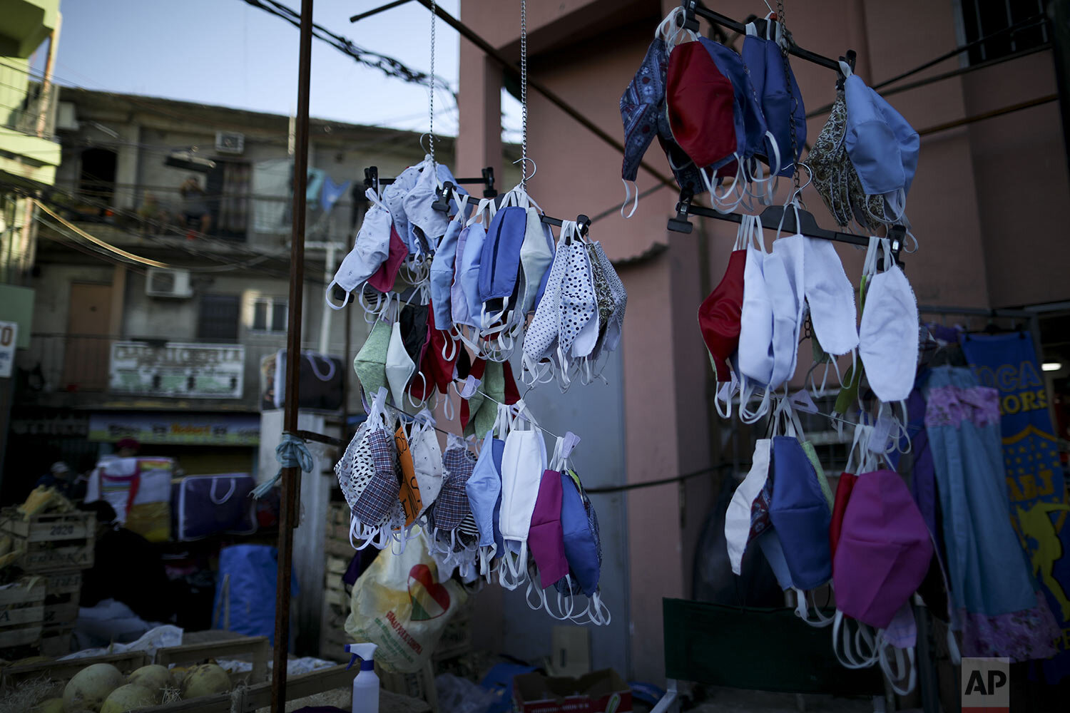  Face masks hang for sale in “Villa 31” in Buenos Aires, Argentina, Friday, May 1, 2020. (AP Photo/Natacha Pisarenko) 