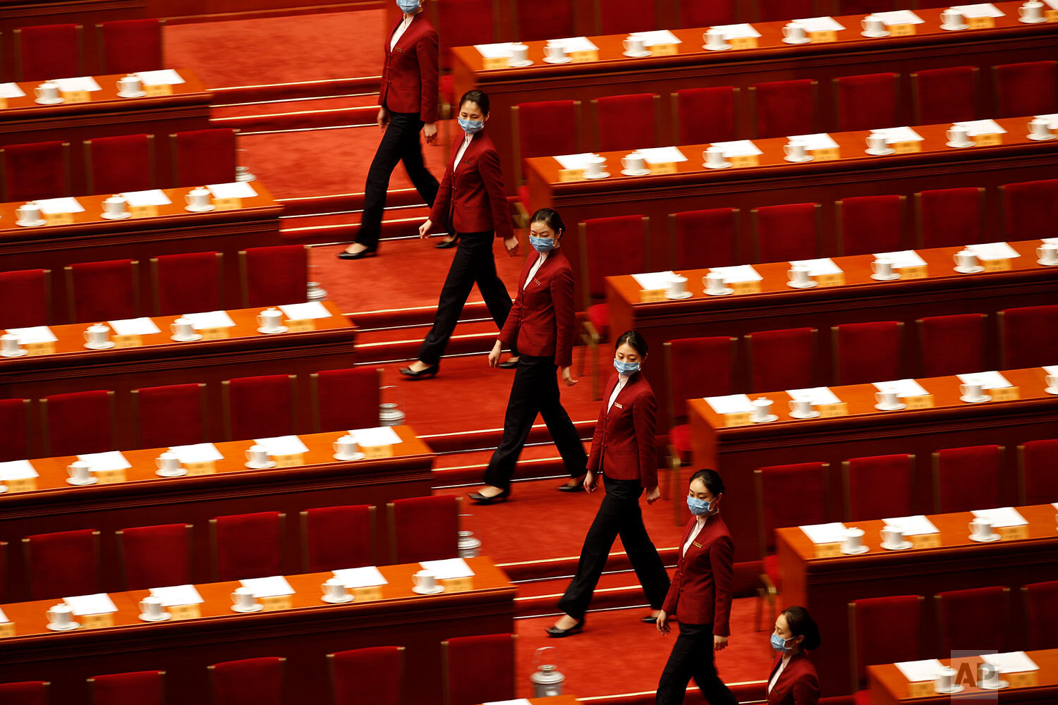  Tea hostesses prepare for the closing session of the Chinese People's Political Consultative Conference (CPPCC) at the Great Hall of the People in Beijing on Wednesday, May 27, 2020. (AP Photo/Andy Wong) 