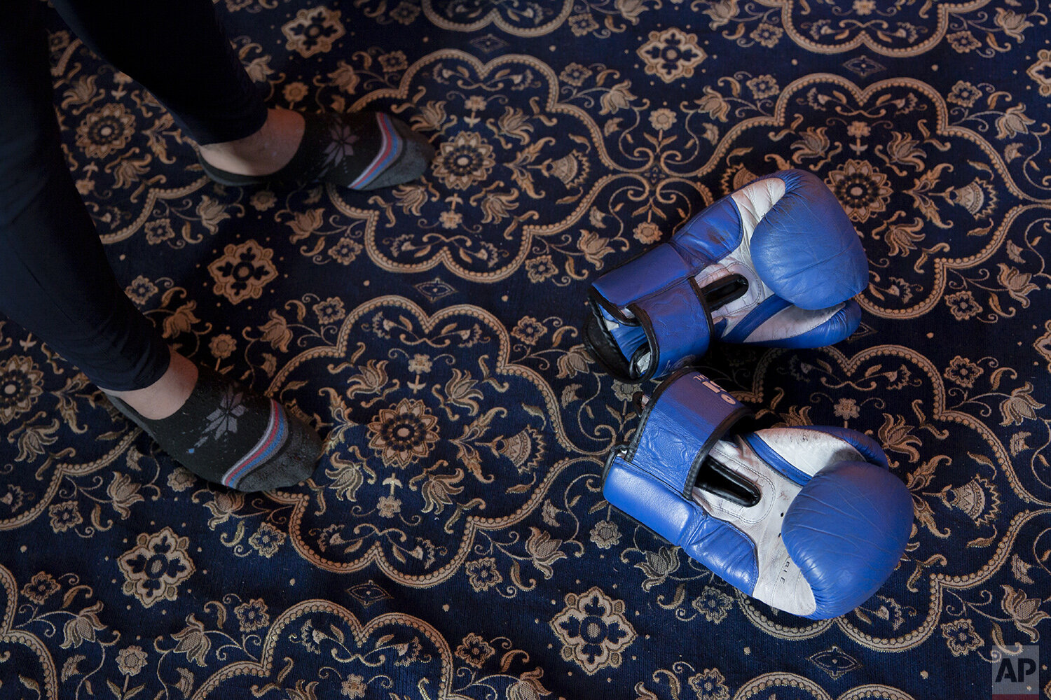  Boxing gloves of Eyed Akeel Khan lie on the floor of the room where he practices in Srinagar, Indian controlled Kashmir, April 23, 2020. Like many other athletes, the coronavirus pandemic has restricted Khan to his home. But lockdown for the 7 milli