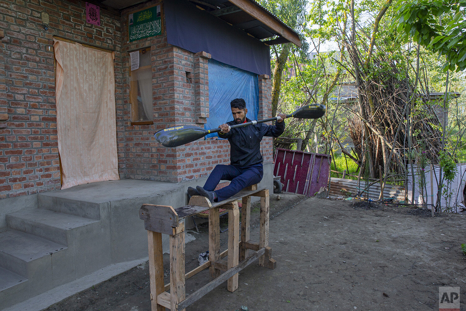  Kashmiri kayaker Vilayat Hussain practices on a rugged under-construction wooden ergometer at his home on the outskirts of Srinagar, Indian controlled Kashmir, April 24, 2020. Like many other athletes, the coronavirus pandemic has restricted Hussain