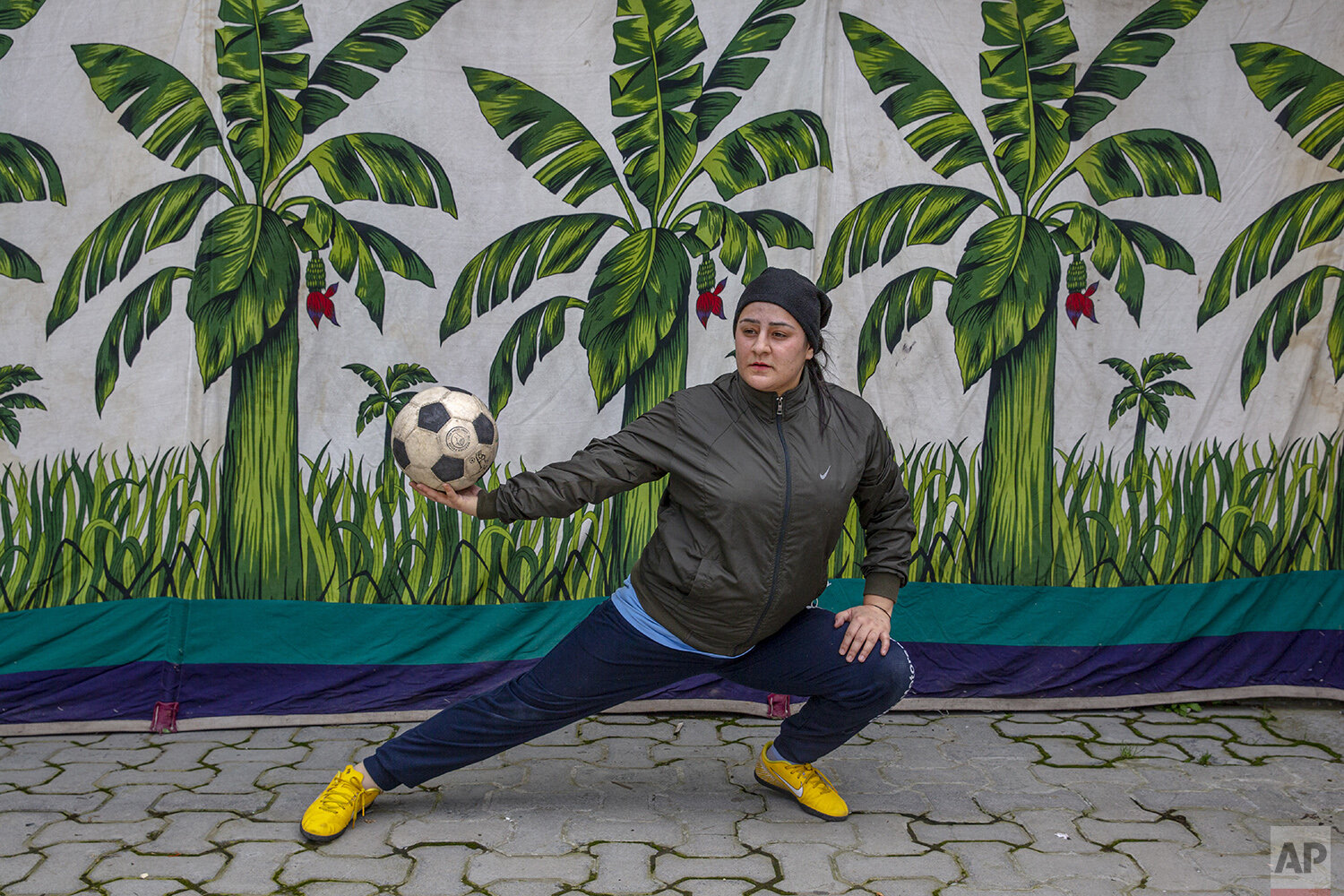  Kashmiri football coach Qudsiya Altaf poses for a photograph during practice inside a school compound that belongs to her father, near her home in Srinagar, Indian controlled Kashmir, April 20, 2020. Like many other athletes, the coronavirus pandemi