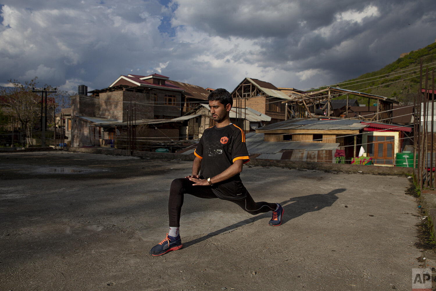  An ultra-marathon runner Hamid Aziz practices on the roof of an abandoned community hall outside his house in Srinagar Indian controlled Kashmir, April 21, 2020. Like many other athletes, the coronavirus pandemic has restricted Aziz to his home. “By