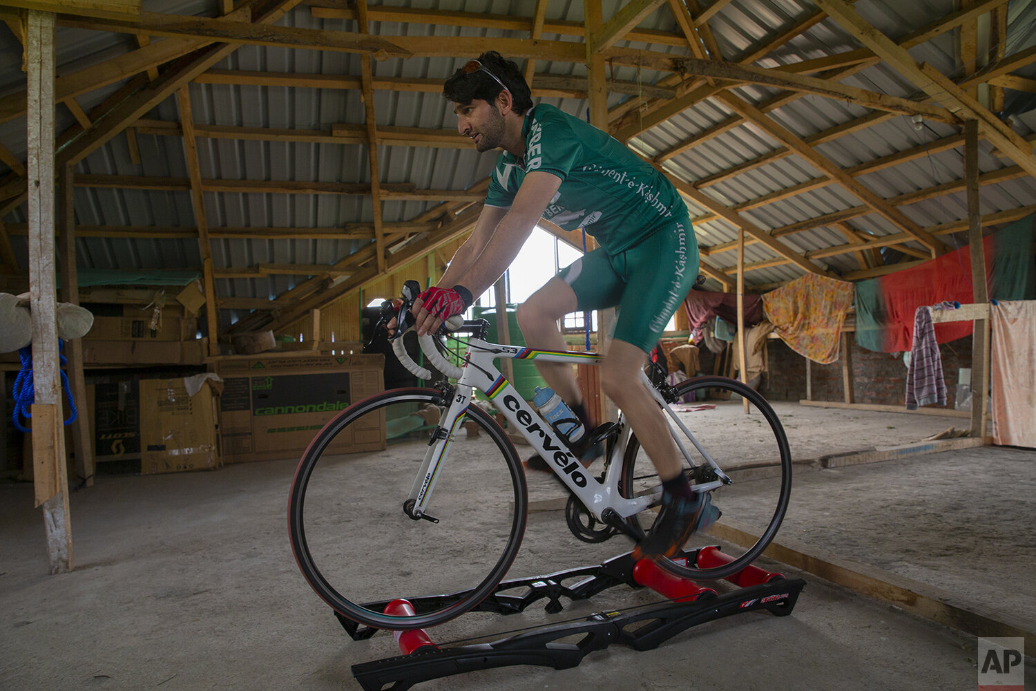  Umer Nabi cycles on top of rollers inside his home in Burzahamahe, on the outskirts of Srinagar, Indian controlled Kashmir, April 28, 2020. Lockdown for the 7 million residents of Kashmir is nothing new and the ongoing restrictions due to the pandem