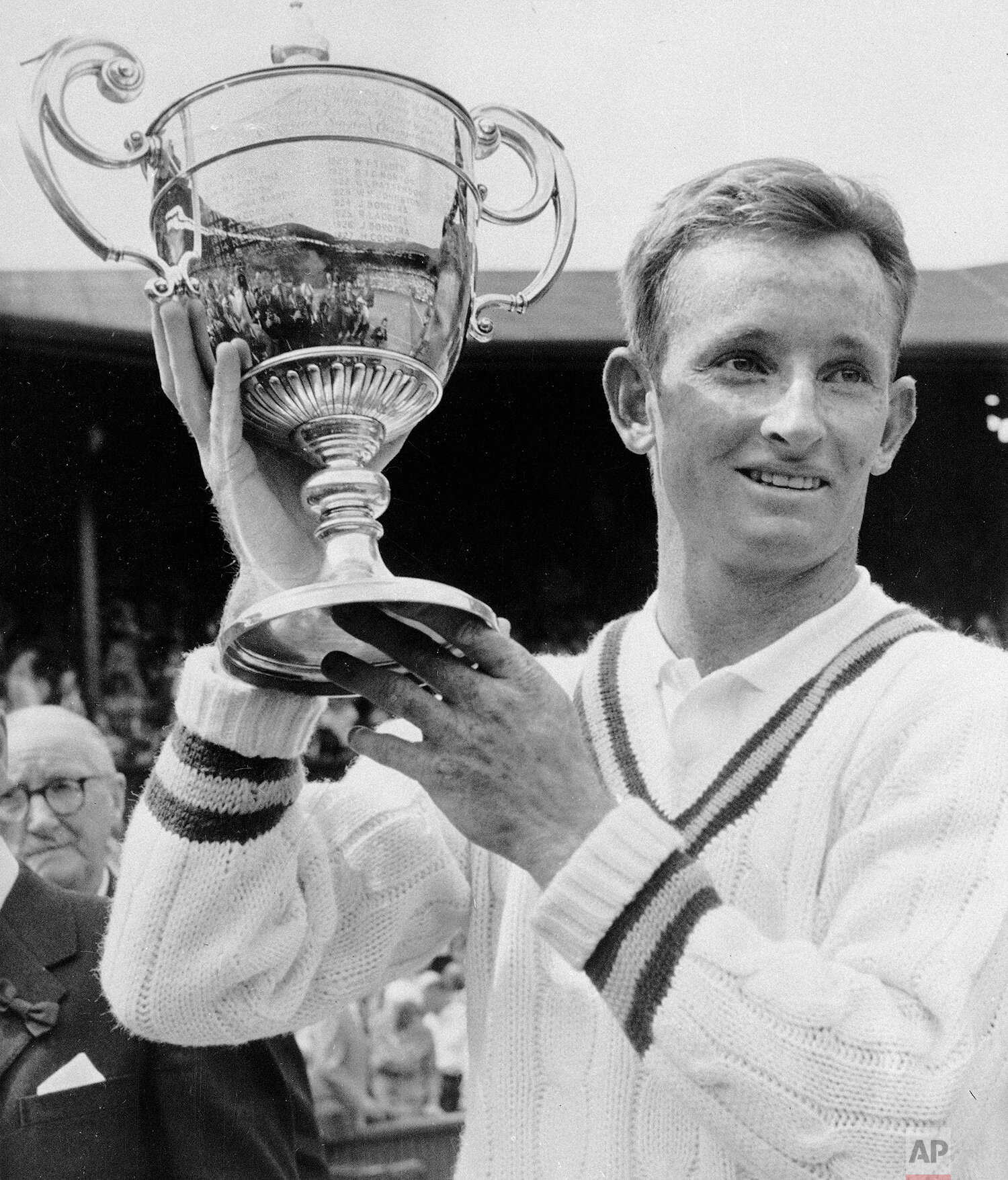  Rod Laver of Australia holds up the men's singles trophy he won in the All England Lawn Tennis Championship at Wimbledon, July 7, 1961.  (AP Photo) 