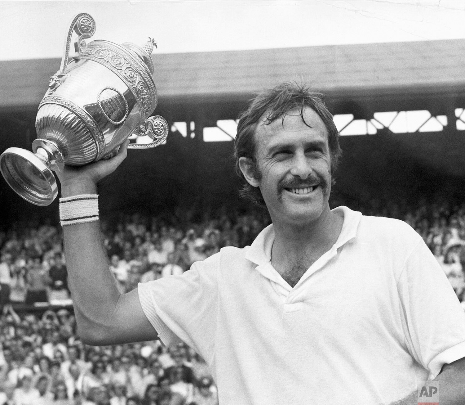  John Newcombe of Australia poses with the trophy presented to him by HRH The Duke of Kent at Wimbledon, July 3, 1971 after retaining his men's singles title against Stan Smith of Pasadena, California, on the Centre Court, winning by 6-3, 5-7, 2-6, 6