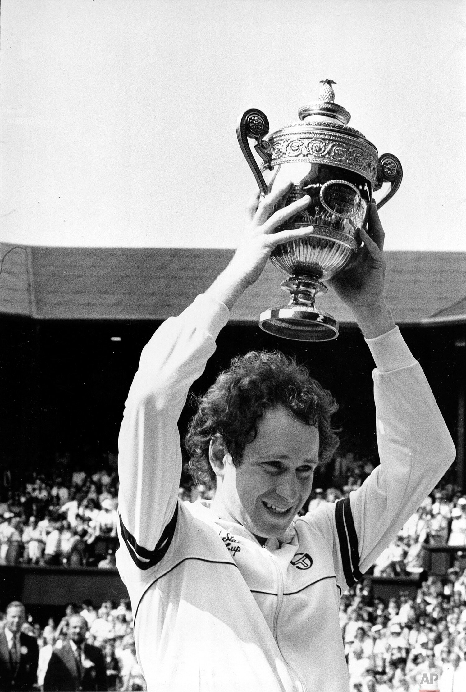  John McEnroe, of the United States, holds up his trophy at center court after winning the championship for the second time in his career at Wimbledon, England, July 3, 1983.  McEnroe defeated Chris Lewis of New Zealand, 6-2, 6-2, 6-2. (AP Photo/Robe