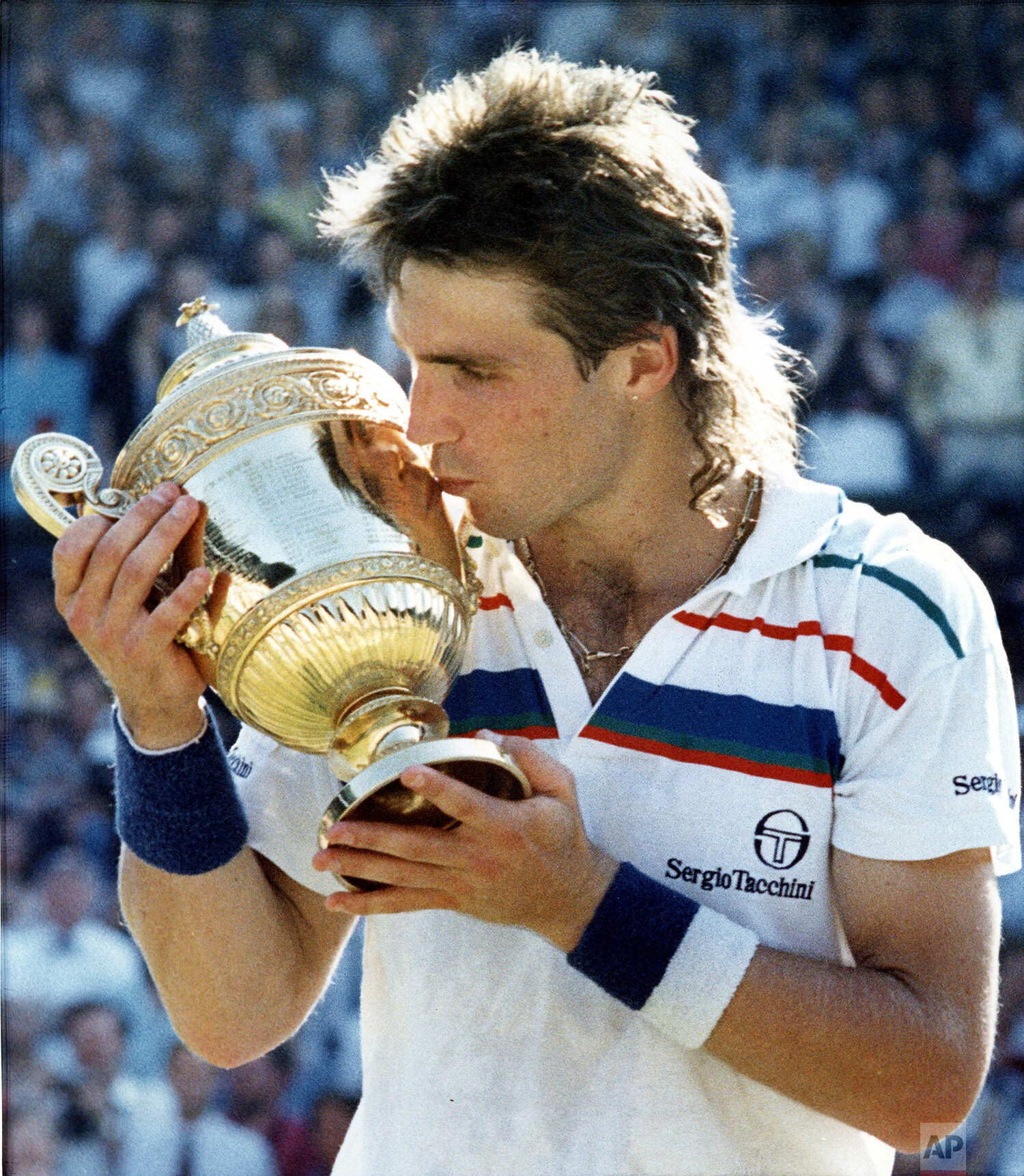  Australian Pat Cash, kisses his trophy on the Centre Court at Wimbledon, July 5, 1987, after defeating Ivan Lendl to take the men's singles championship. (AP Photo/Robert Dear) 