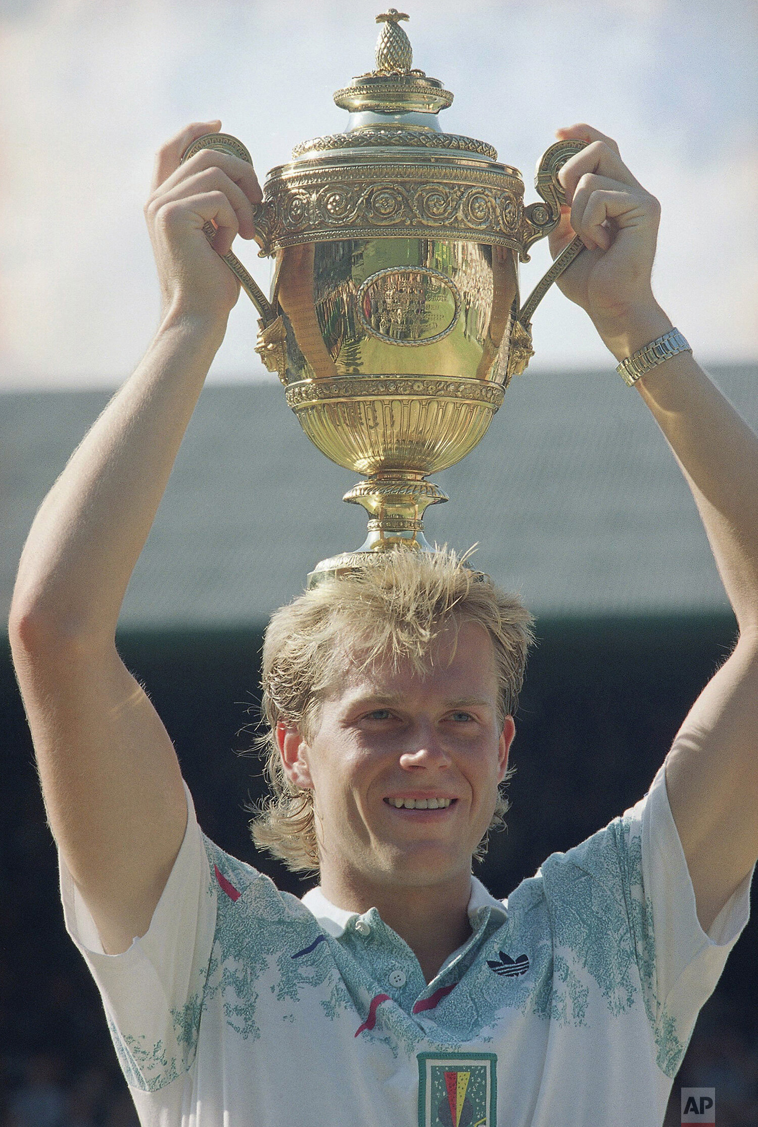  Sweden's Stefan Edberg celebrates with his trophy after beating West Germany's Boris Becker in the mens singles championship at Wimbledon on Sunday, July 9, 1990. Edberg beat Becker 6-2, 6-2, 3-6, 3-6, 6-4 for his second singles title at Wimbledon. 