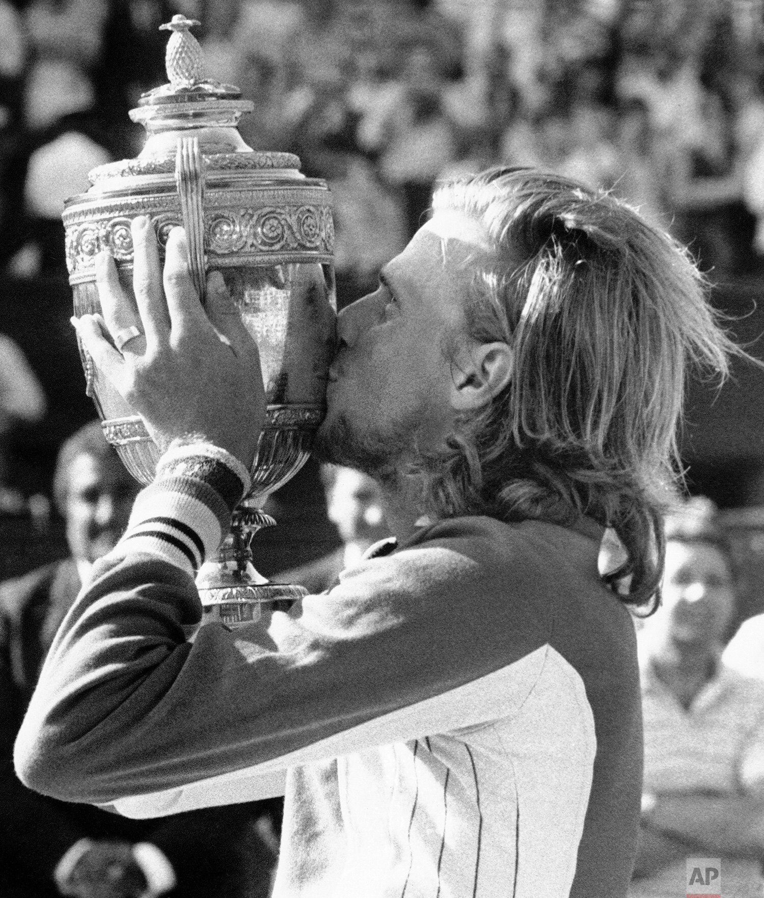  Sweden's Bjorn Borg kisses his trophy on Centre Court at Wimbledon, July 2, 1974, after beating Jimmy Connors of the United States, 3-6, 6-2, 6-1, 5-7, 6-4 to retain the men's singles title. (AP Photo) 
