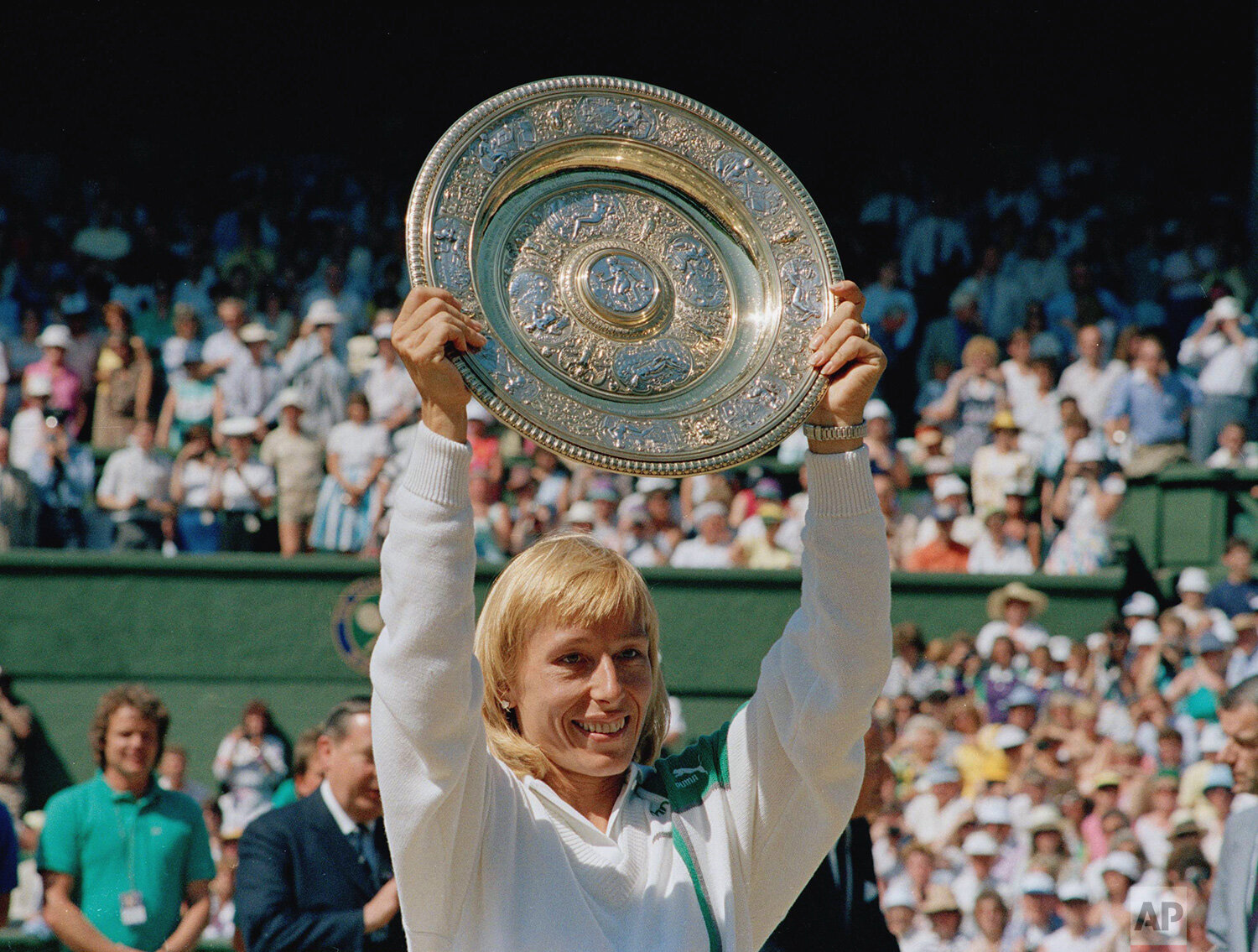  Martina Navratilova holds up her trophy after winning the women's singles championship for a record eight times on the Centre Court at Wimbledon, England, Saturday, July 4, 1987. Navratilova defeated Steffi Graf 7-5, 6-4 to win the championship. (AP