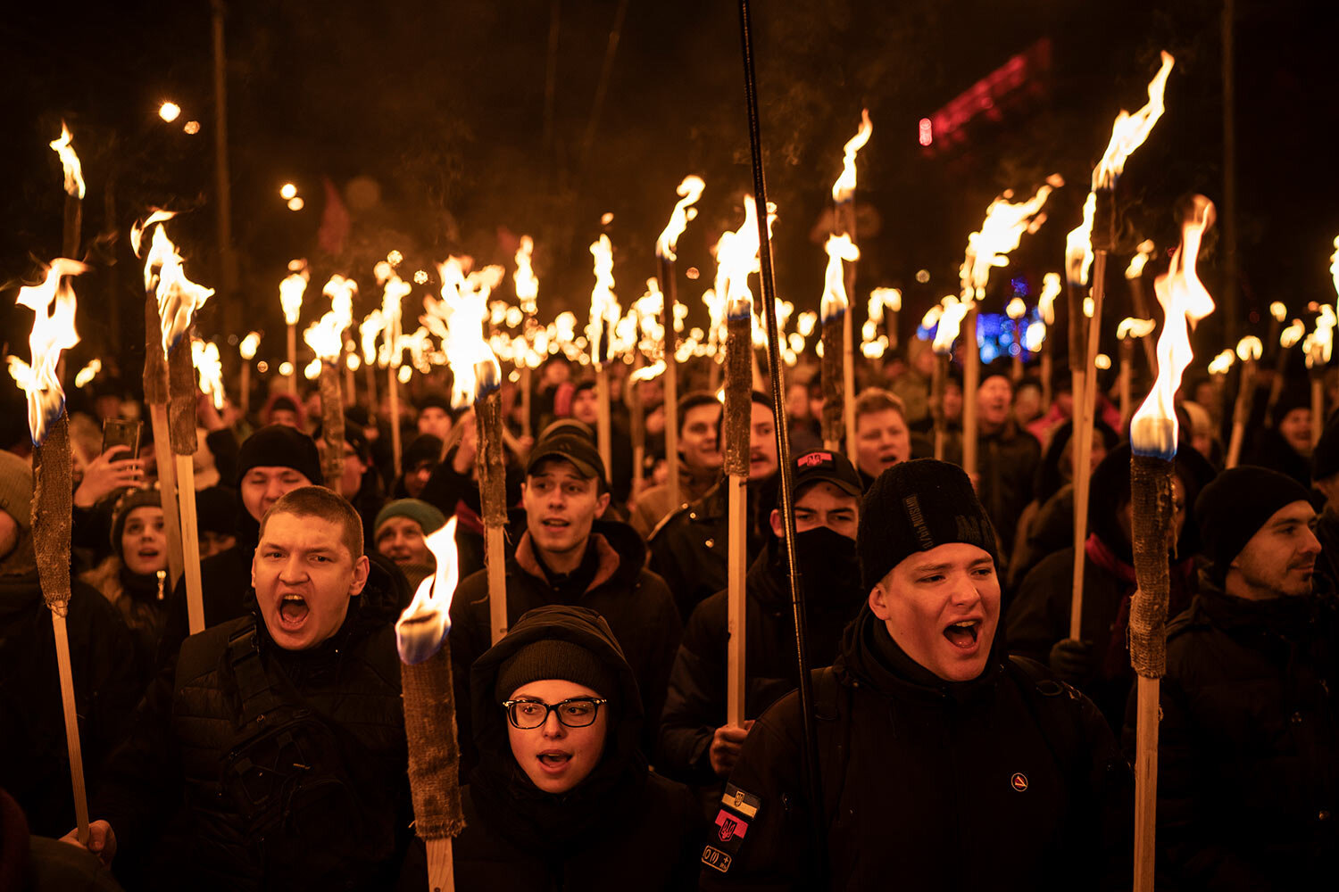  In this Jan. 1, 2019 photo, Nationalist carry torches during a rally to mark the birth anniversary of Stepan Bandera, founder of a rebel army that fought against the Soviet regime, in Kiev, Ukraine. (AP Photo/Felipe Dana) 