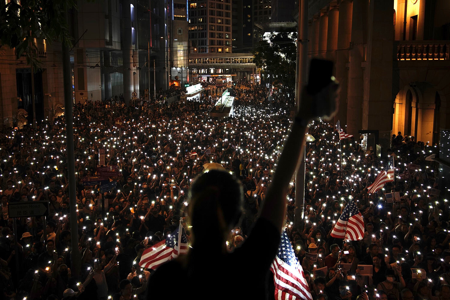  Protestors light their torches during a peaceful rally in central Hong Kong's business district, Monday, Oct. 14, 2019. The protests that started in June over a now-shelved extradition bill have since snowballed into an anti-China campaign amid ange