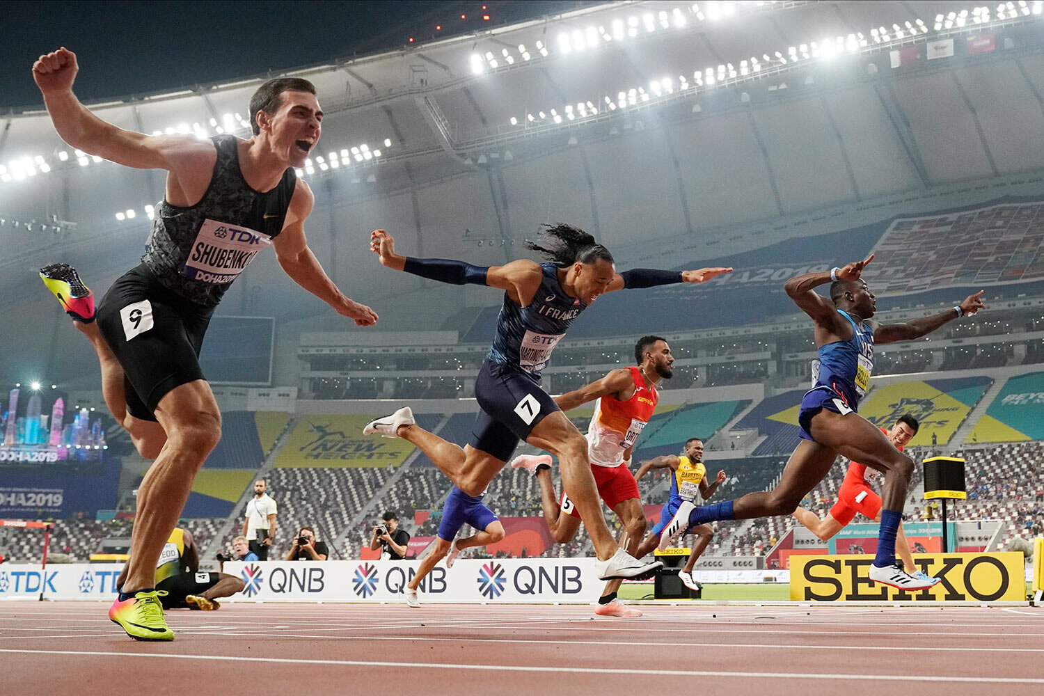  Gold medallist Grant Holloway, of the United States, right, crosses the finish line ahead of Pascal Martinot-Lagarde, of France (7), and Orlando Ortega, of Spain (5), to win the men's 110 meter hurdles final at the World Athletics Championships in D