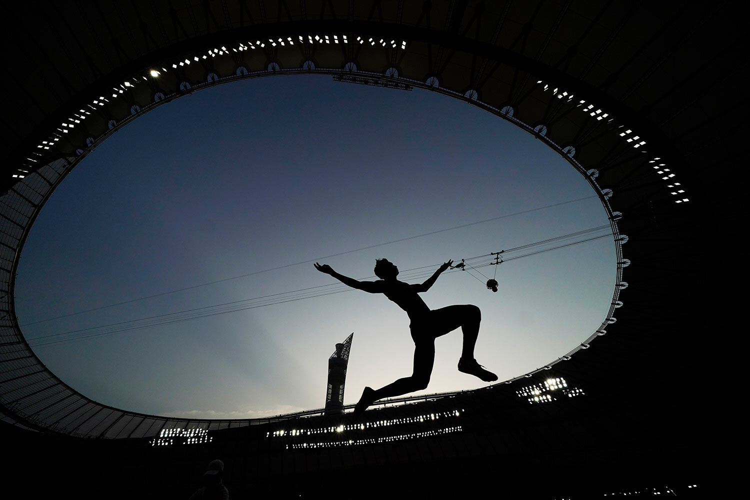  An athlete competes during the qualifications for the men's long jump event at the World Athletics Championships in Doha, Qatar, Friday, Sept. 27, 2019. (AP Photo/David J. Phillip) 