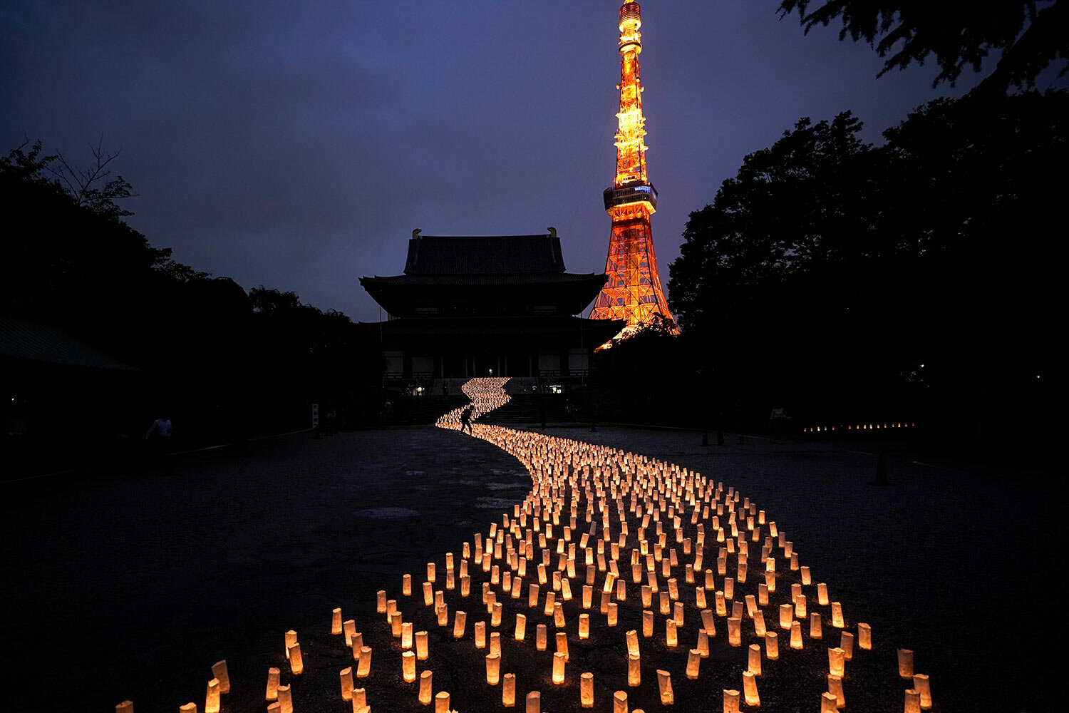  Thousands of candles are arranged in the shape of the Milky Way to celebrate Tanabata, a Japanese star festival, at Zojoji Temple Friday, July 5, 2019, in Tokyo. (AP Photo/Jae C. Hong) 