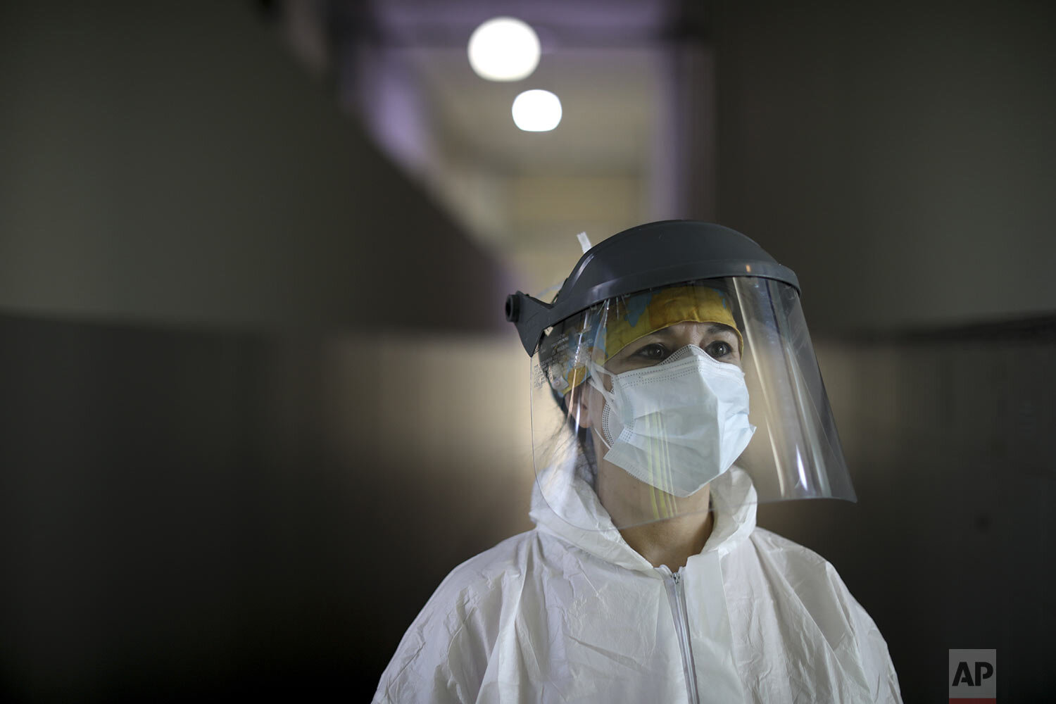  Andrea Cortes, a 49-year-old nurse, dressed in full protective gear, stands inside the Hospital Pineiro, in Buenos Aires, Argentina, Friday, July 17, 2020.  (AP Photo/Natacha Pisarenko) 