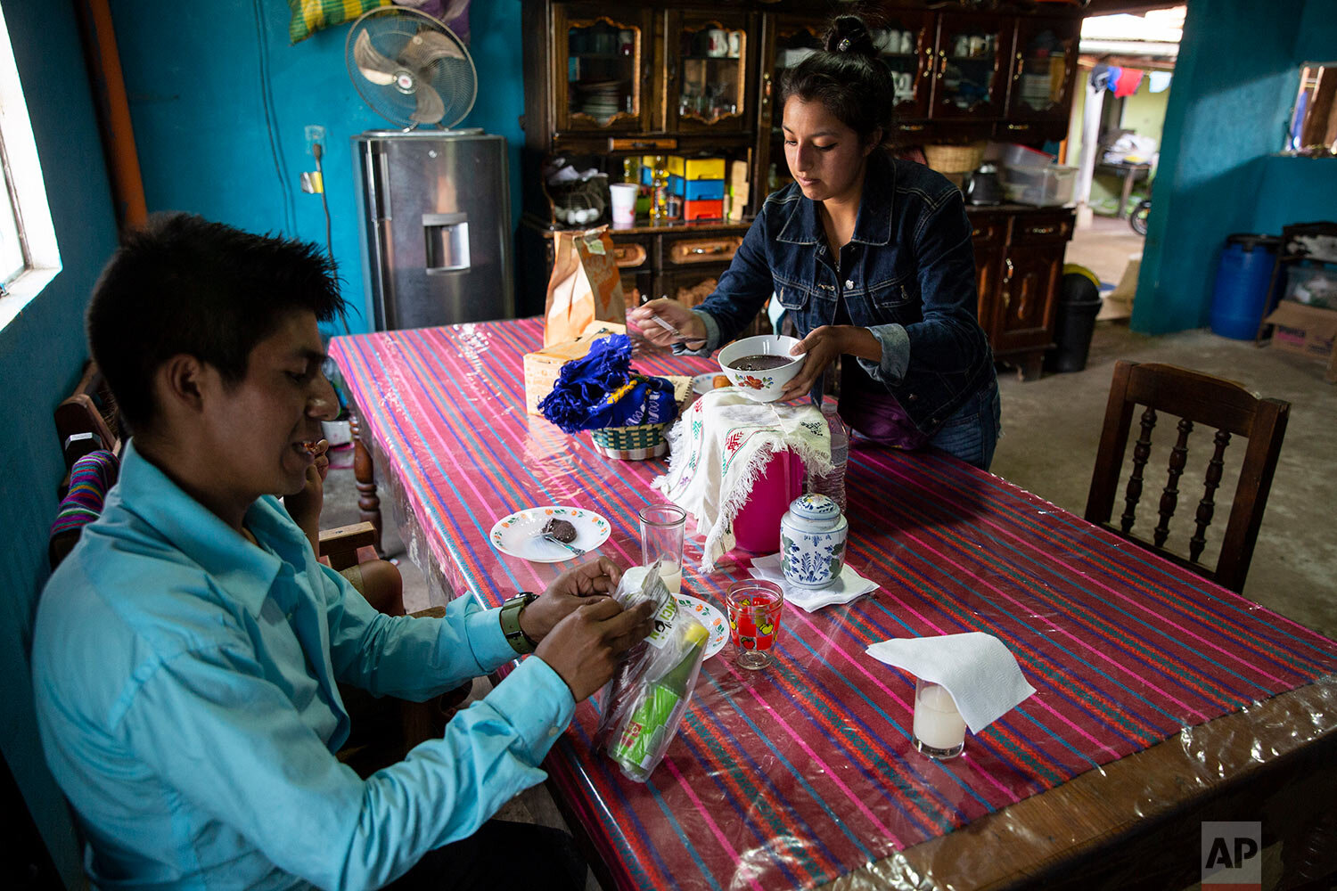 Teacher Gerardo Ixcoy and his wife Yessika Lopez prepare to have lunch in their home in Santa Cruz del Quiche, Guatemala, Wednesday, July 15, 2020. "One day the mother of a student told me they didn't have food," Ixcoy said. "When class ended and I 