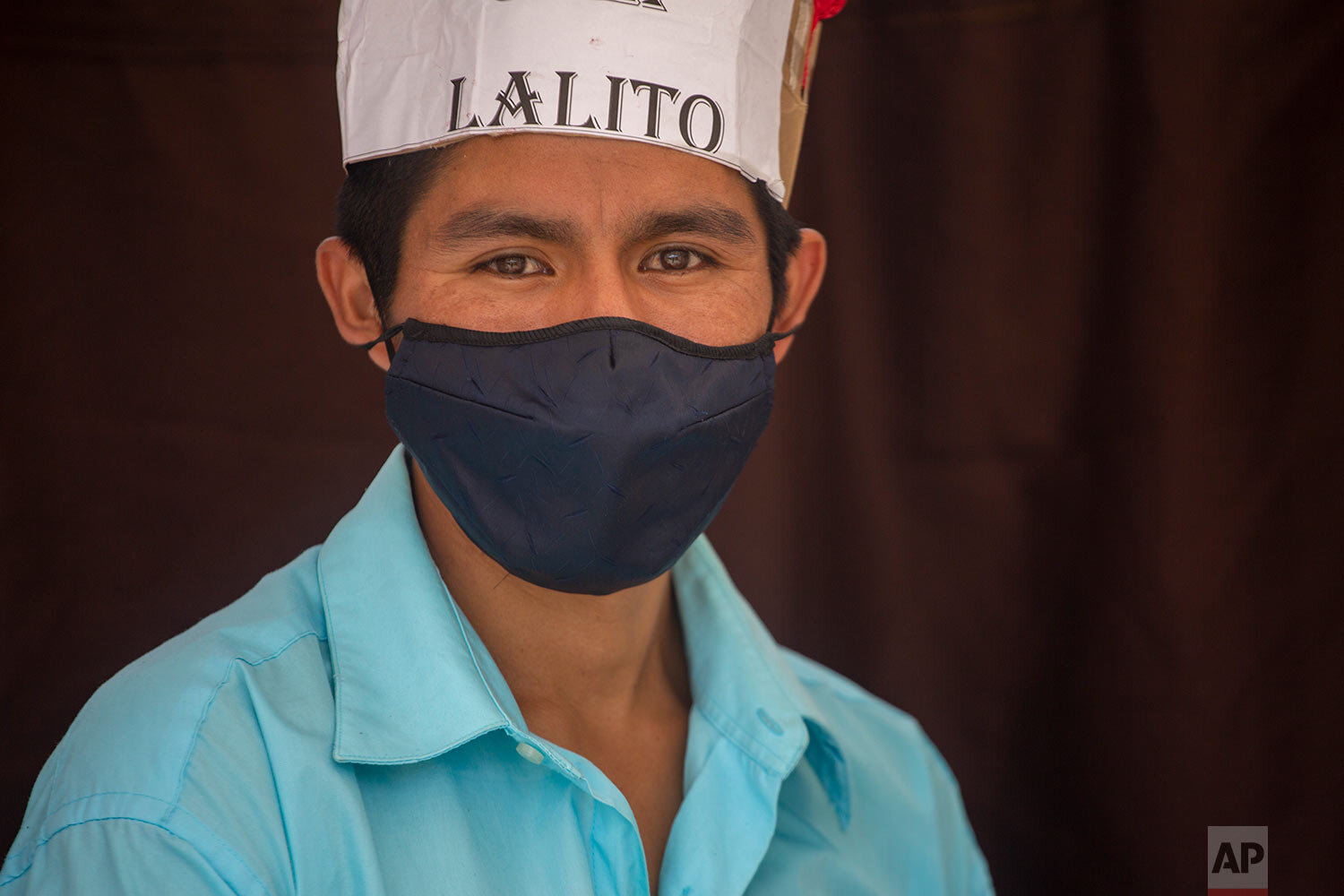  Teacher Gerardo Ixcoy, wearing a protective face mask, found a way to give individual instruction to his sixth-grade students amid the new coronavirus pandemic, in Santa Cruz del Quiche, Guatemala, Wednesday, July 15, 2020. Ixcoy, known universally 