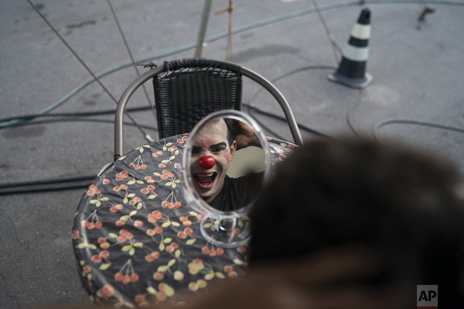  Clown Batatinha, played by Anderson de Souza, makes a face as he puts on his clown face before performing at the Estoril Circus in Itaguai, in greater Rio de Janeiro, Brazil, July 18, 2020. (AP Photo/Leo Correa) 
