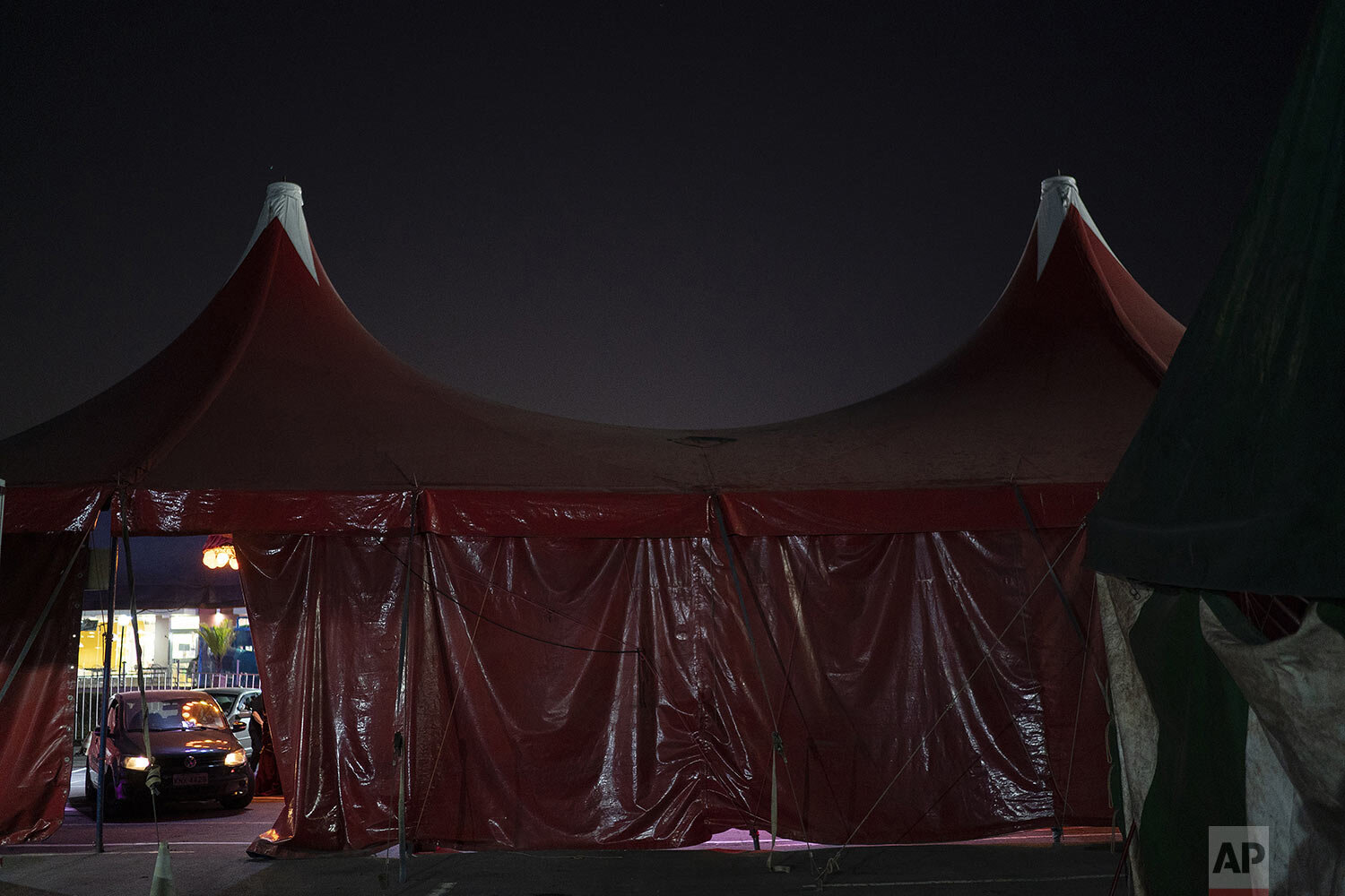  Drivers arrive to watch the Estoril Circus drive-in show in Itaguai, in greater Rio de Janeiro, Brazil, July 18, 2020. (AP Photo/Leo Correa) 