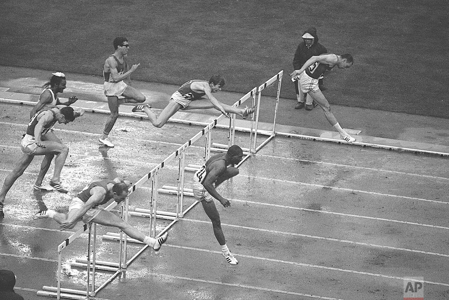  Hayes Jones of Detroit, bottom right, and Blaine Lindgren of Salt Lake City, clear the last hurdle in the 110-meter hurdle final which Jones won, at the Olympic Games in Tokyo, Oct. 18, 1964. At bottom left is Anatoly Mikhailov of the USSR (3rd).  A