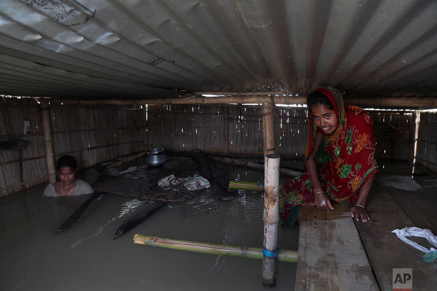 Indian flood affected villagers are seen inside their partially submerged houses in Gagolmari village, Morigaon district, Assam, India, Tuesday, July 14, 2020. (AP Photo/Anupam Nath) 