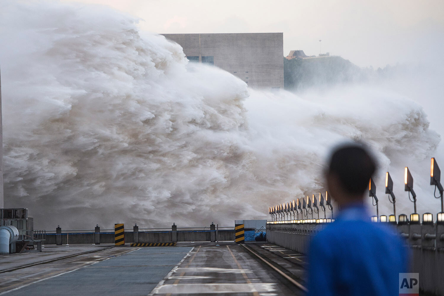  In this photo released by Xinhua News Agency, floodwaters are discharged at the Three Gorges Dam in central China's Hubei province on Sunday, July 19, 2020. (Xiao Yijiu/Xinhua via AP) 