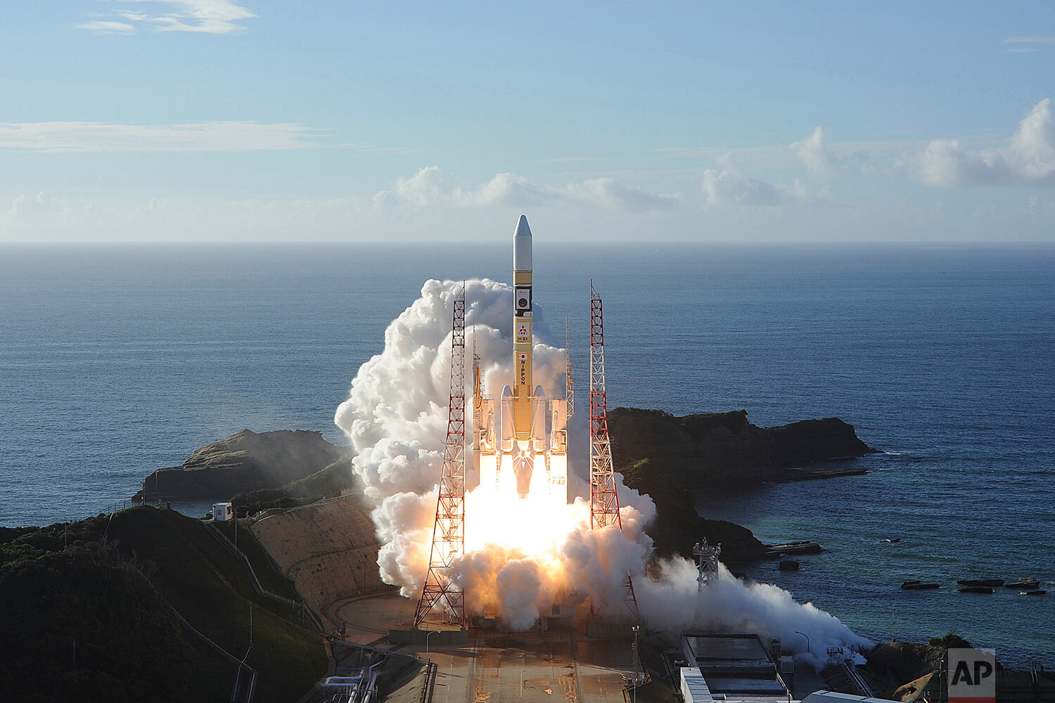  In this photo released by MHI, an H-IIA rocket with United Arab Emirates' Mars orbiter Hope lifts off from Tanegashima Space Center in Kagoshima, southern Japan Monday, July 20, 2020. (MHI via AP) 