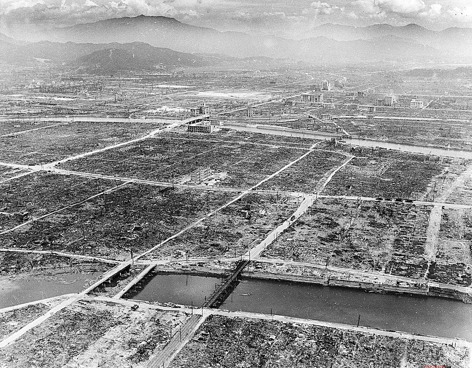  A few steel and concrete buildings and bridges are still intact in Hiroshima after the Japanese city was hit by an atomic bomb by the U.S., during World War II Sept. 5, 1945.  (AP Photo/Max Desfor) 