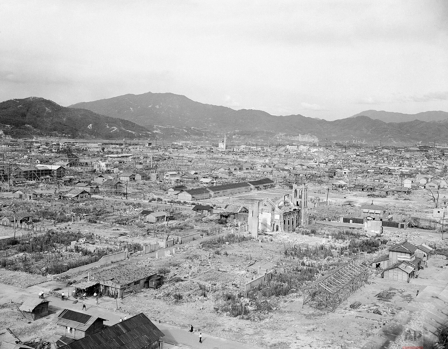  Aerial view of the city one year after the atomic bomb blast, shows some small amount of reconstruction amid much ruin in Hiroshima, Japan on July 20, 1946. (AP Photo/Charles P. Gorry) 