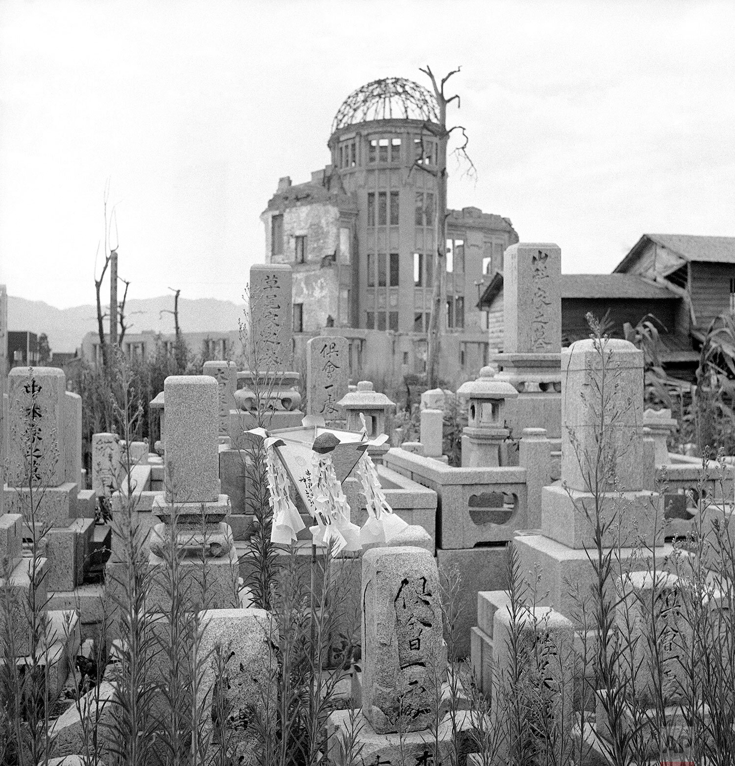 The graveyard of the Sairenji Temple near the center of the A-bomb blast in Hiroshima, Japan on August 7, 1948, background steel frame is Exhibition Gallery, which has been left un-repaired as a monument. (AP Photo) 