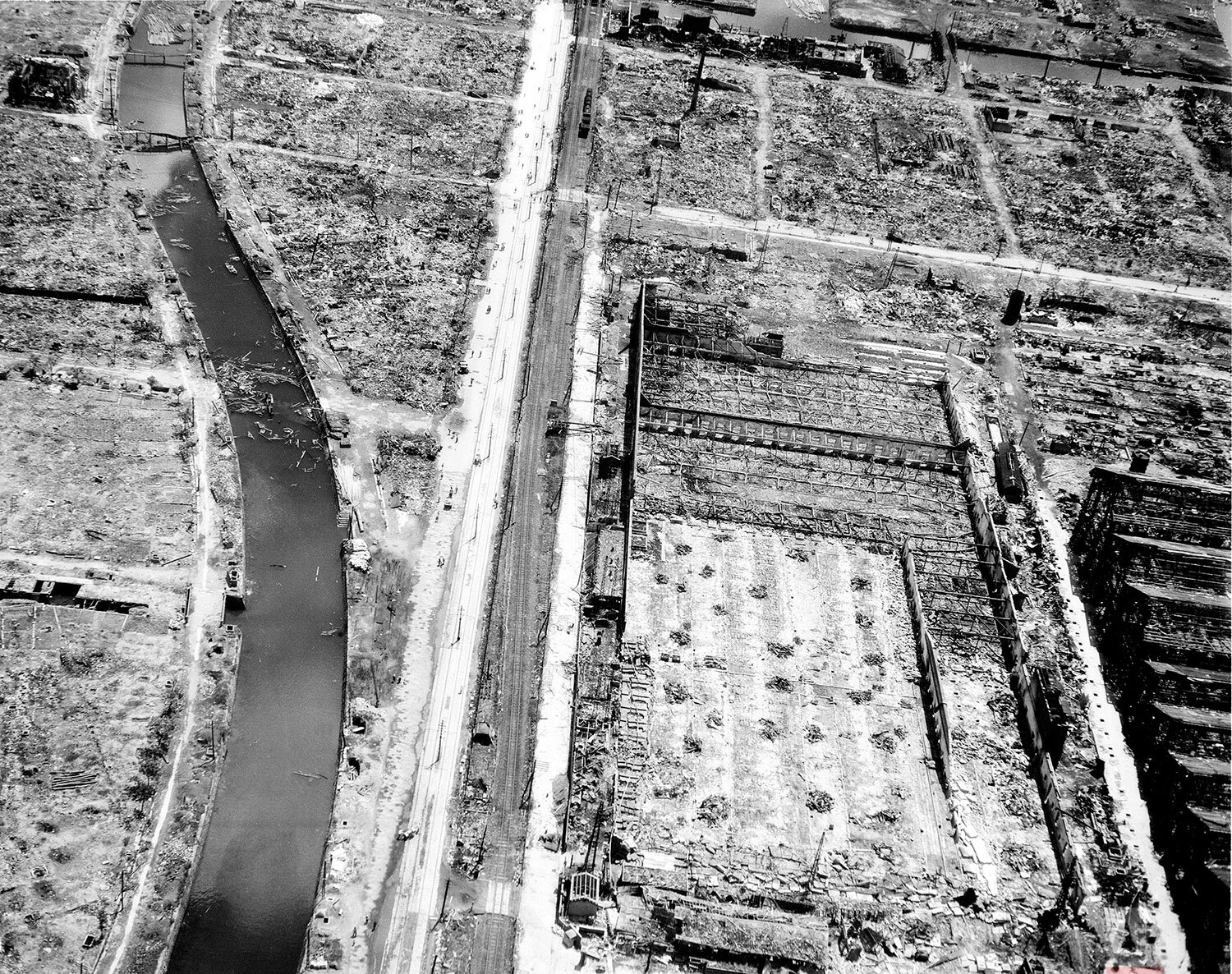  This aerial view shows the extensive damage caused by the atomic bomb dropped by the U.S. on Nagasaki, Japan, Sept. 6, 1945 in World War II.  About one-third of the Japanese city was destroyed when the atomic bomb was dropped on Aug. 9.  (AP Photo) 