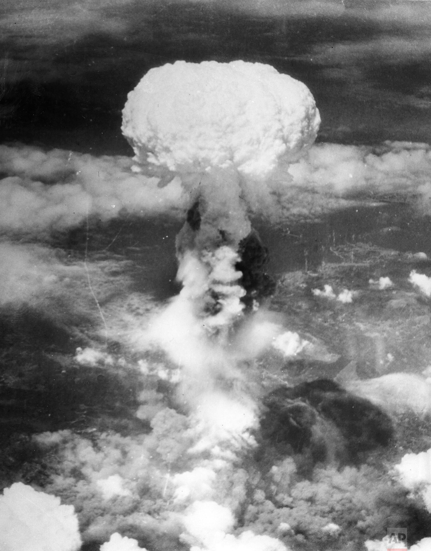  A giant column of smoke rises more than 60,000 feet into the air, after the second atomic bomb ever used in warfare explodes over the Japanese port town of Nagasaki, on August 9, 1945. Dropped by the U.S. Army Air Forces B-29 plane "Bockscar," the b