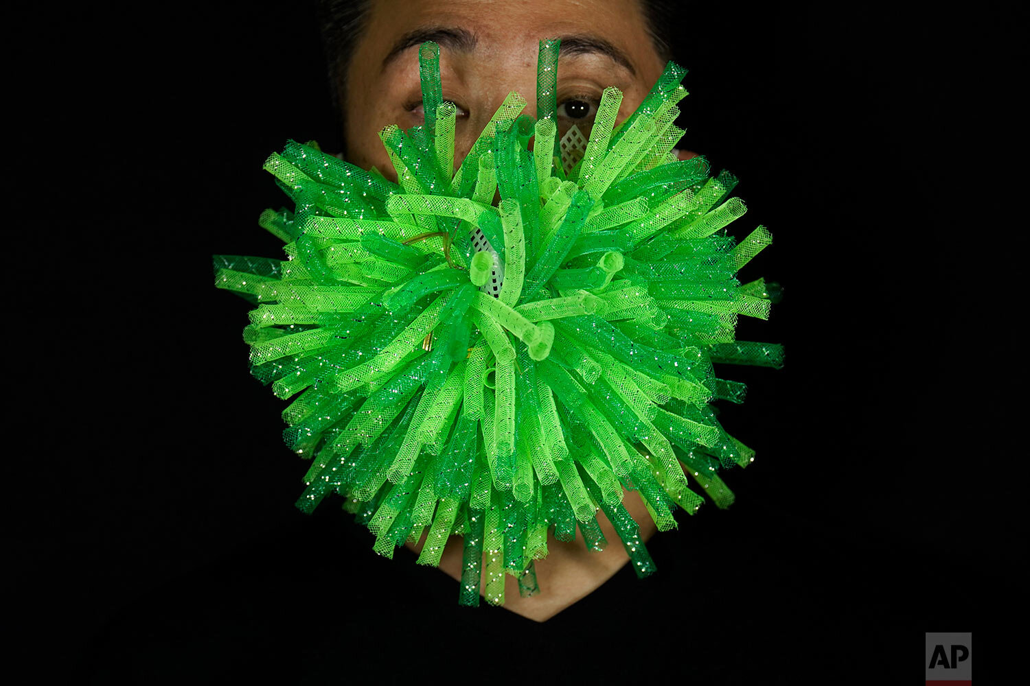  Edmond Kok, a Hong Kong theater costume designer and actor, wearing a spiky green mask which is a 3D visualisation of corona virus in Hong Kong Thursday, Aug. 6, 2020. (AP Photo/Vincent Yu) 