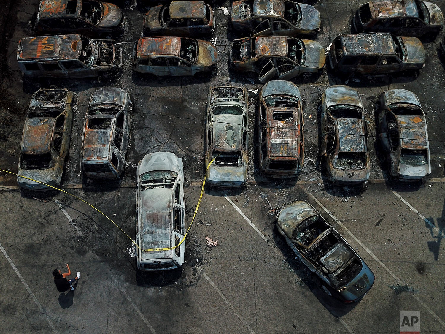  Burned out vehicles are seen Monday, Aug. 24, 2020, in Kenosha, Wis. Many of the cars were set on fire during protests Sunday night after a police shooting in the city. (AP Photo/Morry Gash) 