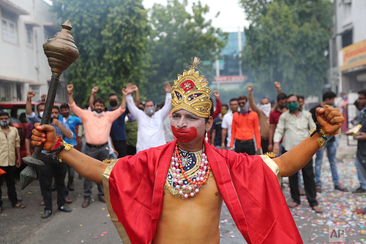  A man dressed as Hindu god Hanuman participates in a celebration by Vishwa Hindu Parishad or World Hindu Council to mark the groundbreaking ceremony of a temple dedicated to Hindu god Ram in Ayodhya, in Ahmedabad, India, Wednesday, Aug. 5, 2020.  (A