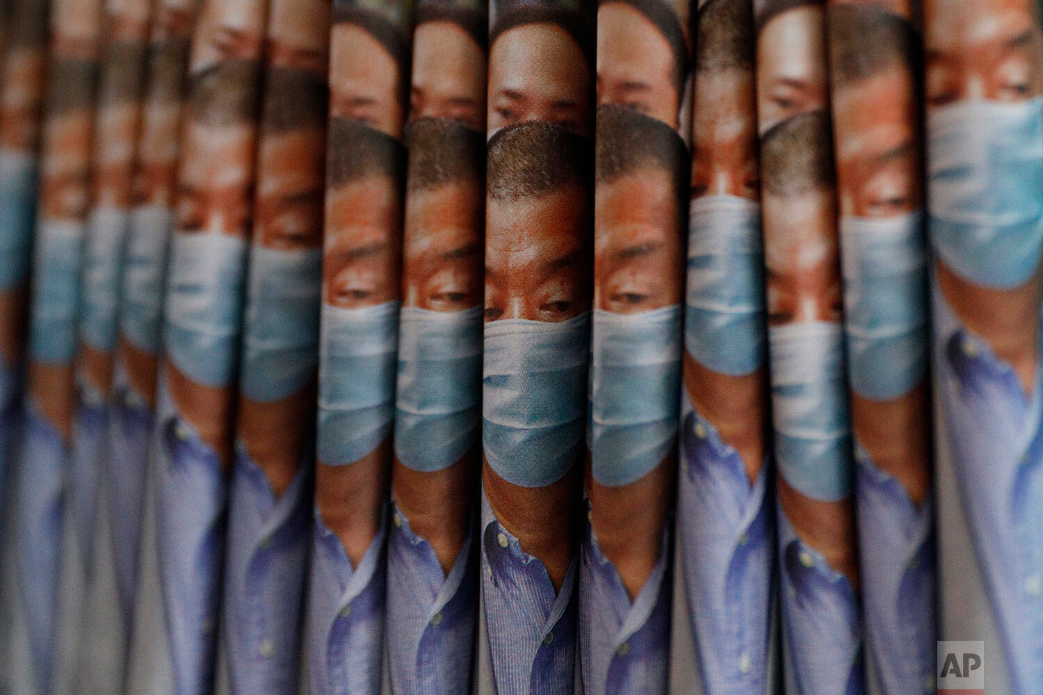  Copies of Apple Daily newspaper with front pages featuring Hong Kong media tycoon Jimmy Lai, are displayed for sale at a newsstand in Hong Kong, Tuesday, Aug. 11, 2020.  (AP Photo/Kin Cheung) 