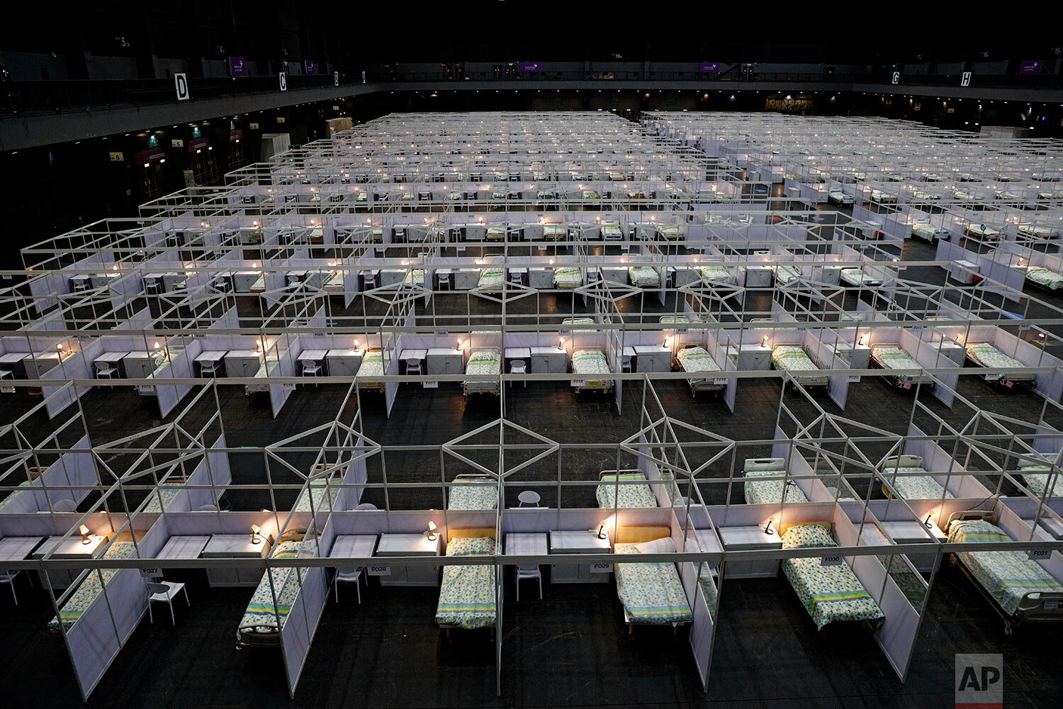 Rows of beds are set up at a temporary COVID-19 field hospital at the Asia World Expo in Hong Kong, Saturday, Aug. 1, 2020. (AP Photo/Kin Cheung) 