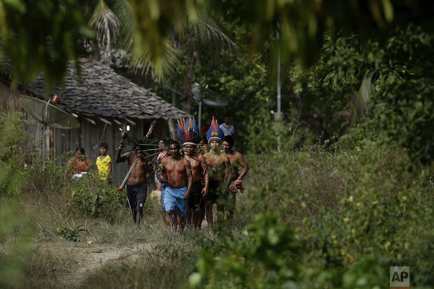 Members of the Tenetehara Indigenous arrive to take part in a festival in the Alto Rio Guama Indigenous Reserve, near Paragominas, in the northern Brazilian state of Para, Monday, Sept. 7, 2020. (AP Photo/Eraldo Peres) 