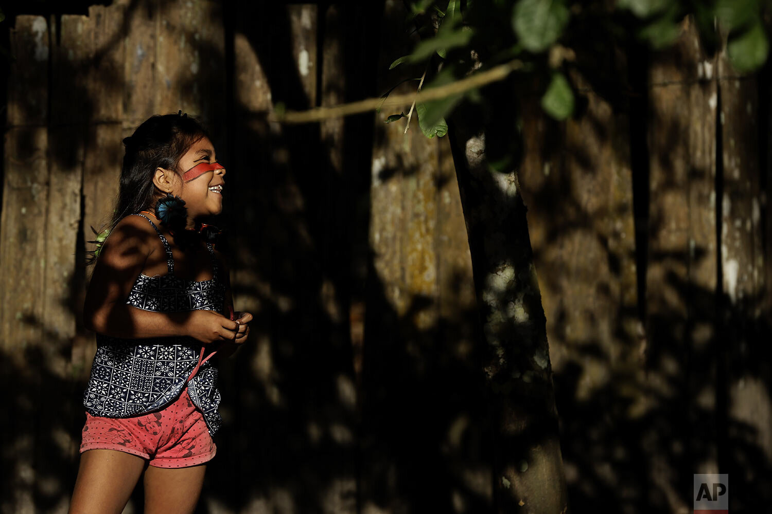  A Tenetehara Indigenous child Mayra Muxi Tembe, plays outside her home in the Alto Rio Guama Indigenous Territory, near Paragominas, in the northern Brazilian state of Para, Monday, Sept. 7, 2020. (AP Photo/Eraldo Peres) 