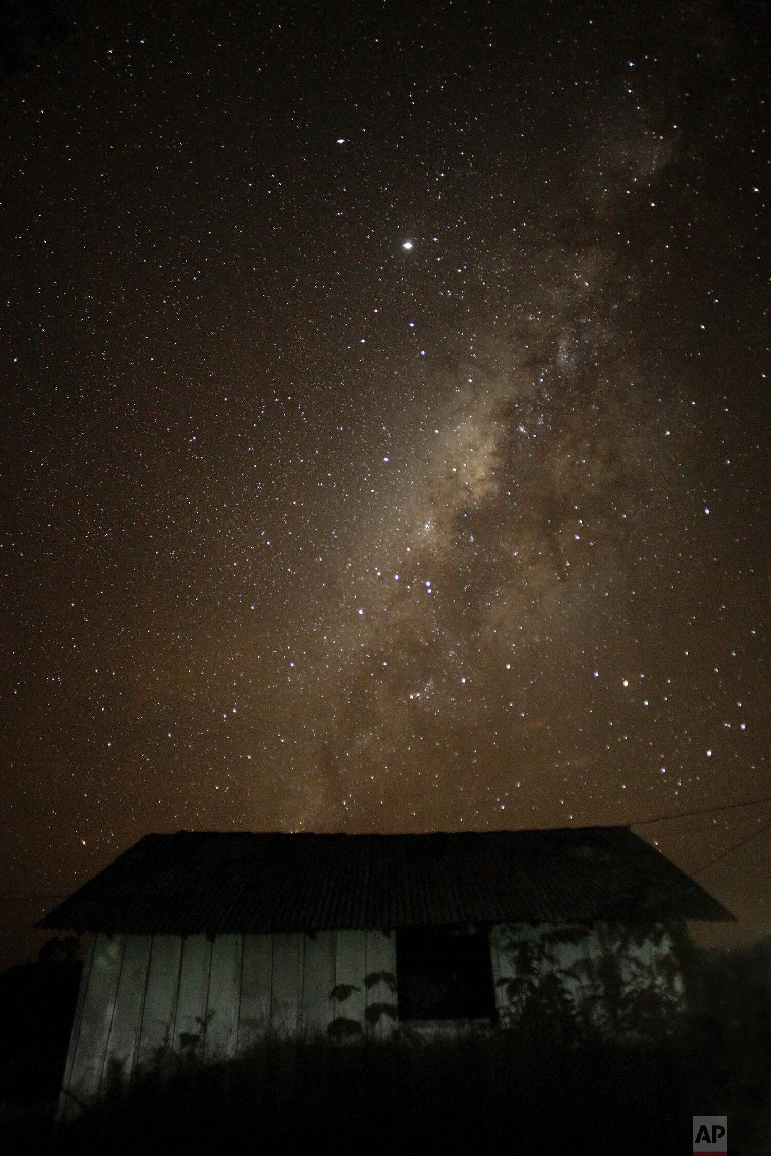  A view of the St. Benedict Chapel backdropped by a starlit night sky in the Alto Rio Guama Indigenous Reserve, where Tenetehara Indigenous have enforced six months of isolation during the coronavirus pandemic, near the city of Paragominas, Brazil, M