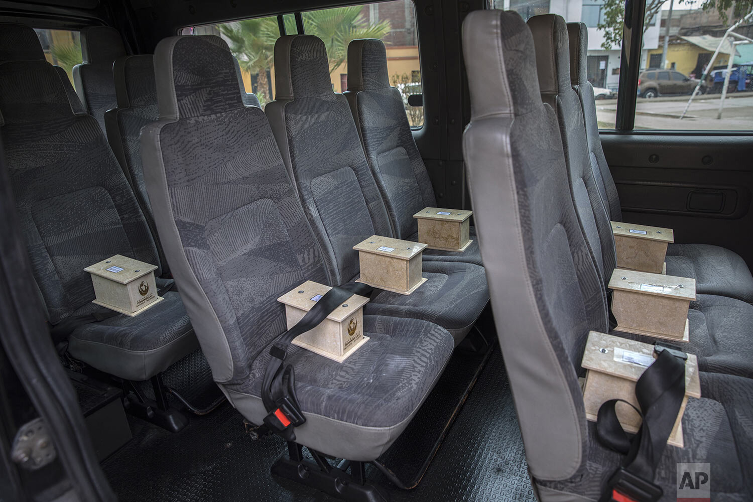  Urns of cremated remains of people who are suspected to have died from COVID-19 sit in a funeral home company van, to be delivered to loved ones in Lima, Peru, June 1, 2020. In March, Peru ordered the cremation of all coronavirus victims to prevent 