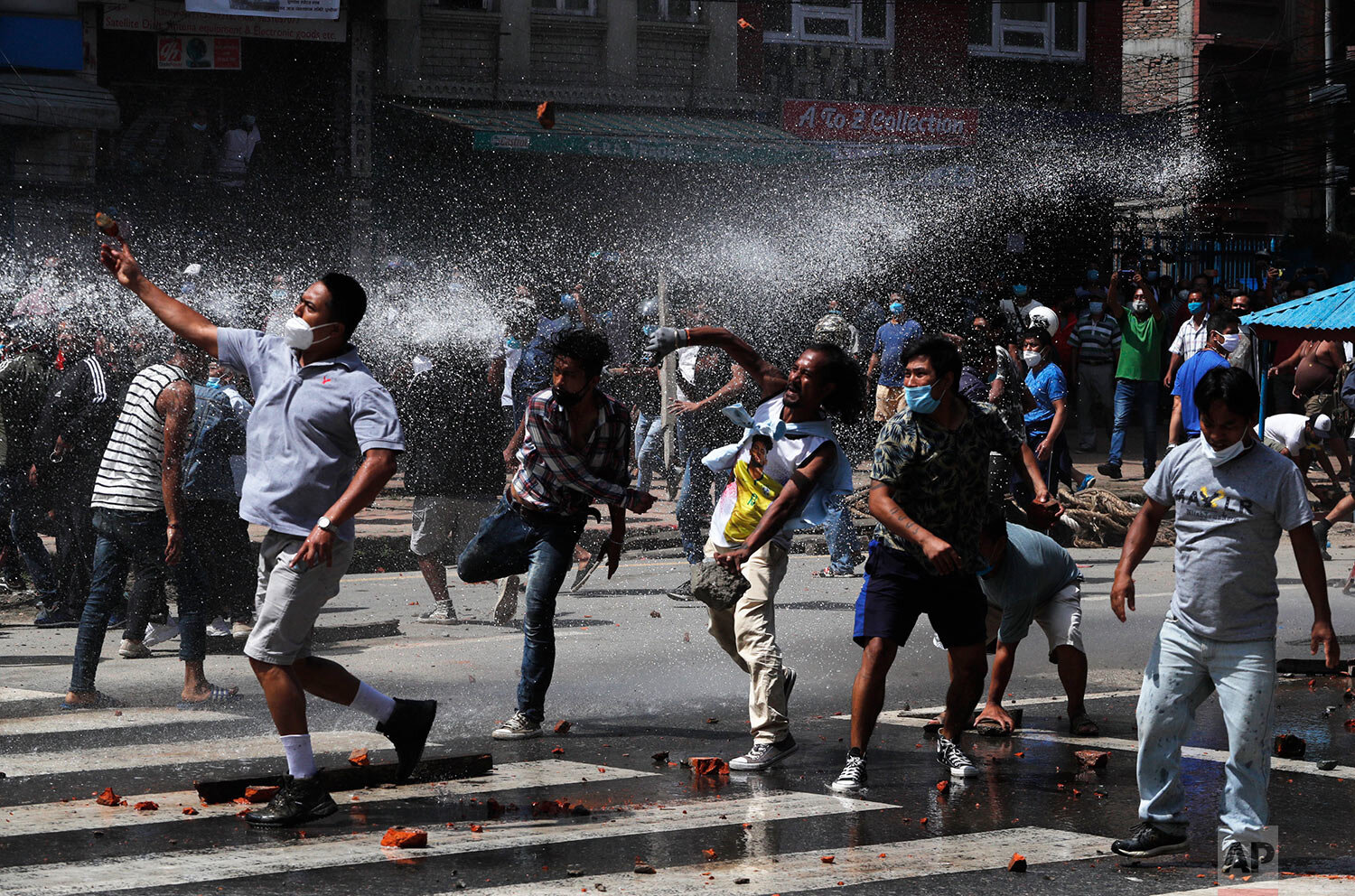  Nepalese protesters defying a government coronavirus lockdown to take part in a religious festival clash with riot police, in Lalitpur, Nepal, Thursday, Sept. 3, 2020. (AP Photo/Niranjan Shrestha) 